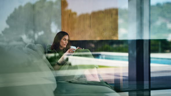 Picture of a woman looking at the screen of her mobile phone